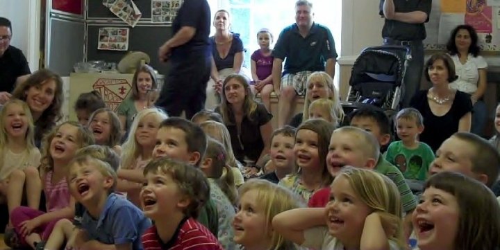 Children laughing at preschool performance of Mr. Magichead.
